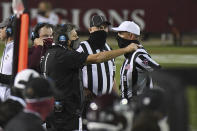 Mississippi State coach Mike Leach talks to an official during the first half of the team's NCAA college football game against Arkansas in Starkville, Miss., Saturday, Oct. 3, 2020. (AP Photo/Thomas Graning)