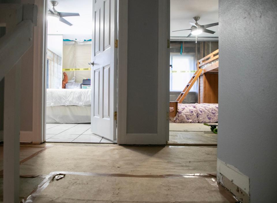 Sara Alvarez had to remove some of her tile flooring and nearly all of the drywall upstairs in her south Fort Myers condo after it was damaged in Hurricane Ian. She and her husband have still not been able to make repairs.
