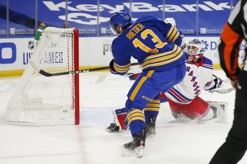 Buffalo Sabres forward Tobias Rieder (13) puts the puck past New York Rangers goalie Alexandar Georgiev (40) during the second period of an NHL hockey game, Tuesday, Jan. 26, 2021, in Buffalo, N.Y. (AP Photo/Jeffrey T. Barnes)