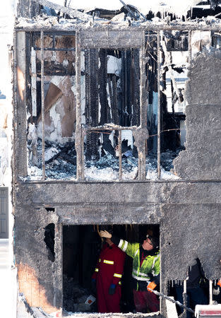 Police and fire invetsigators are on the scene of a fatal house fire in the community of Spryfield in Halifax, Nova Scotia, Canada, February 19, 2019. REUTERS/Ted Pritchard