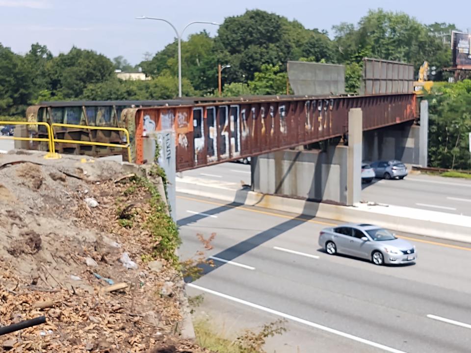 The Pawtuxet Valley Railroad Bridge over Interstate 95 and Wellington Avenue in Cranston, unused since 1991, is being dismantled by the Rhode Island DOT.