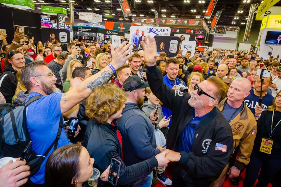 Arnold Schwarzenegger high-fives an attendee at the 2019 Arnold Sports Festival. This year's event will run Thursday through Sunday at the Greater Columbus Convention Center and other sites, with Schwarzenegger appearing at the Arnold Showcase on Sunday in Battelle Grand.