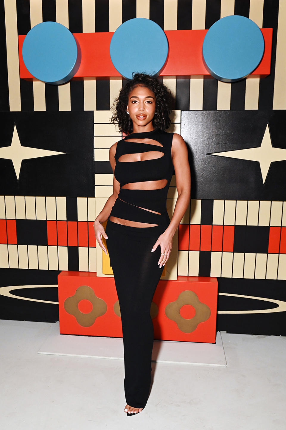 Lori Harvey, sandal heels, Femme La, knitwear, maxi dress.