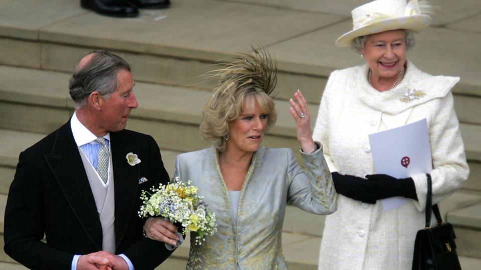 Her Majesty Queen Elizabeth wore a white coat dress to the wedding of Prince Charles and his wife Camilla, Duchess of Cornwall in 2005