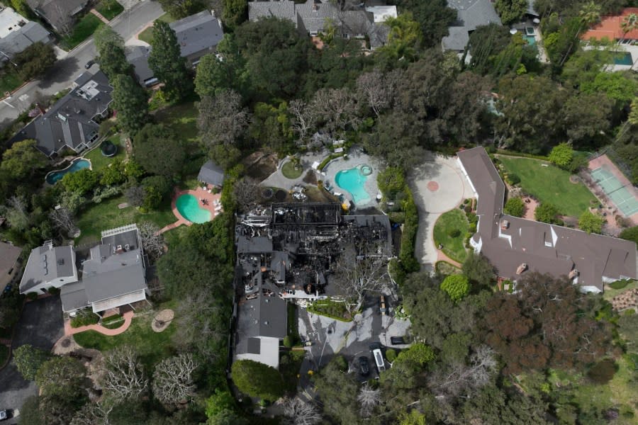 An aerial view shows a fire-damaged property, which appears to belong to Cara Delevingne, Friday, March 15, 2024, in the Studio City section of Los Angeles. (AP Photo/Jae C. Hong)