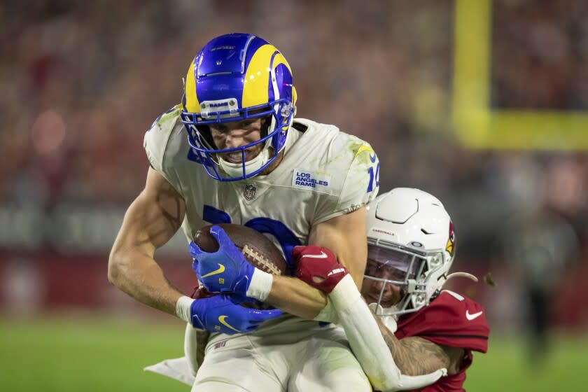 Wide Receiver (10) Cooper Kupp of the Los Angeles Rams catches a pass against the Arizona Cardinals in an NFL football game, Monday, Dec. 13, 2021, in Glendale, AZ. The Rams defeated the Cardinals 30-23. (AP Photo/Jeff Lewis)