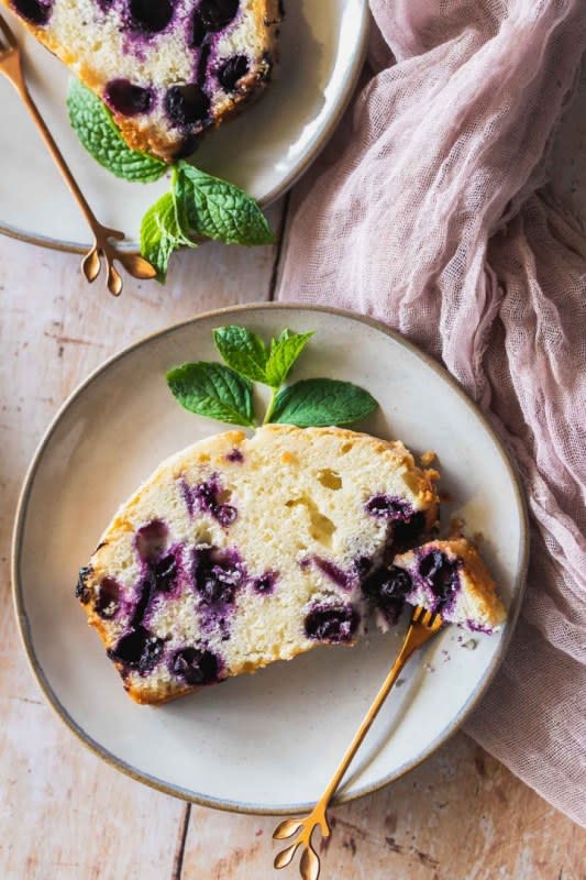 <p>Sweet Tea and Thyme</p><p>This sunny Lemon Blueberry Pound Cake recipe is a fantastic way to to bring the warm weather into the kitchen. It's full of sweet juicy blueberries, has a tender crumb and a heavenly glaze made with fresh lemon juice.</p><p><strong>Get the recipe: <a href="https://www.sweetteaandthyme.com/lemon-blueberry-pound-cake/" rel="nofollow noopener" target="_blank" data-ylk="slk:Lemon Blueberry Sour Cream Pound Cake;elm:context_link;itc:0;sec:content-canvas" class="link rapid-noclick-resp">Lemon Blueberry Sour Cream Pound Cake</a></strong></p>
