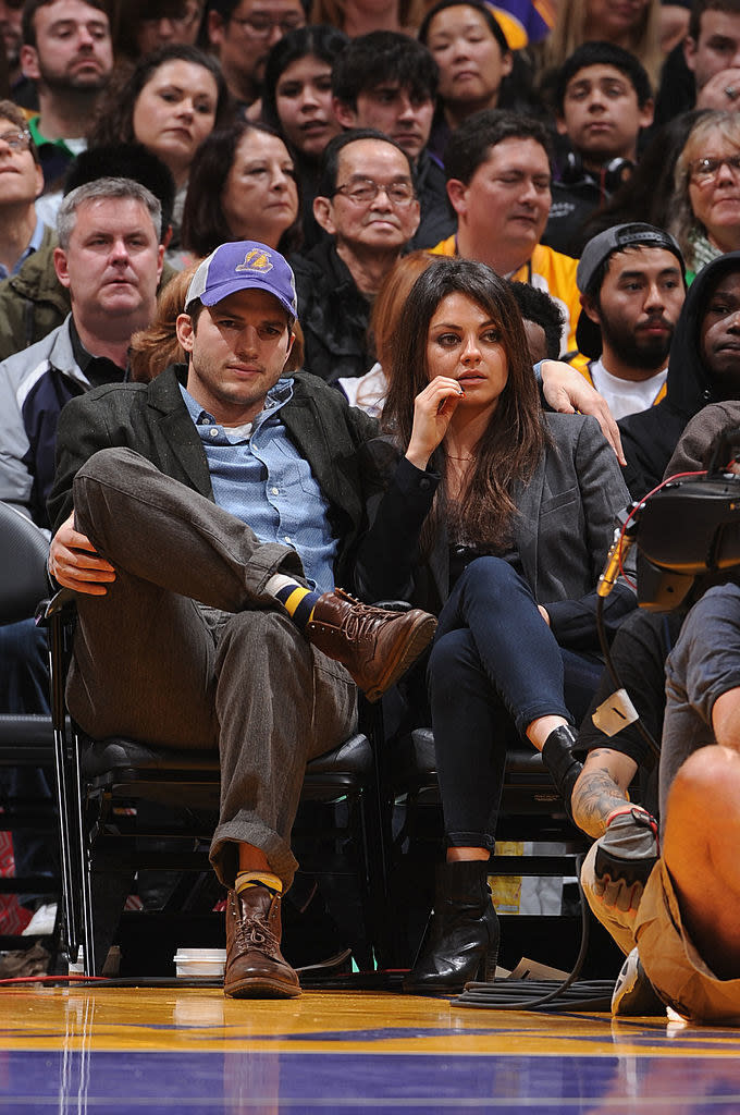 Mila and Ashton courtside at a game