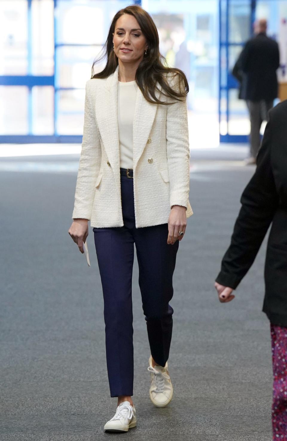 <p>In what might be a <a href="https://people.com/royals/kate-middleton-meets-preet-chandi-following-antarctica-expedition/" rel="nofollow noopener" target="_blank" data-ylk="slk:new uniform;elm:context_link;itc:0;sec:content-canvas" class="link ">new uniform</a>, Princess Kate wore a white tweed blazer with matching top, navy trousers and sporty sneakers to congratulate <a href="https://people.com/royals/kate-middleton-announces-new-patronage-supporting-womans-solo-trek-antarctica/" rel="nofollow noopener" target="_blank" data-ylk="slk:Captain Preet Chandi;elm:context_link;itc:0;sec:content-canvas" class="link ">Captain Preet Chandi</a> on her record-setting expedition in Antarctica.</p> <p>The Princess of Wales served as royal patron of the mission, and joined "Polar Preet" for school visit on Feb. 8 — where she bravely tried <a href="https://people.com/royals/kate-middleton-meets-preet-chandi-following-antarctica-expedition/" rel="nofollow noopener" target="_blank" data-ylk="slk:pulling tires;elm:context_link;itc:0;sec:content-canvas" class="link ">pulling tires</a> like the explorer tugged her sled across the icy continent. </p>