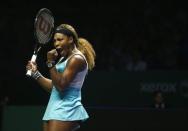 Serena Williams of the U.S. celebrates her victory against Ana Ivanovic of Serbia during their WTA Finals singles tennis match in Singapore October 20, 2014. REUTERS/Edgar Su