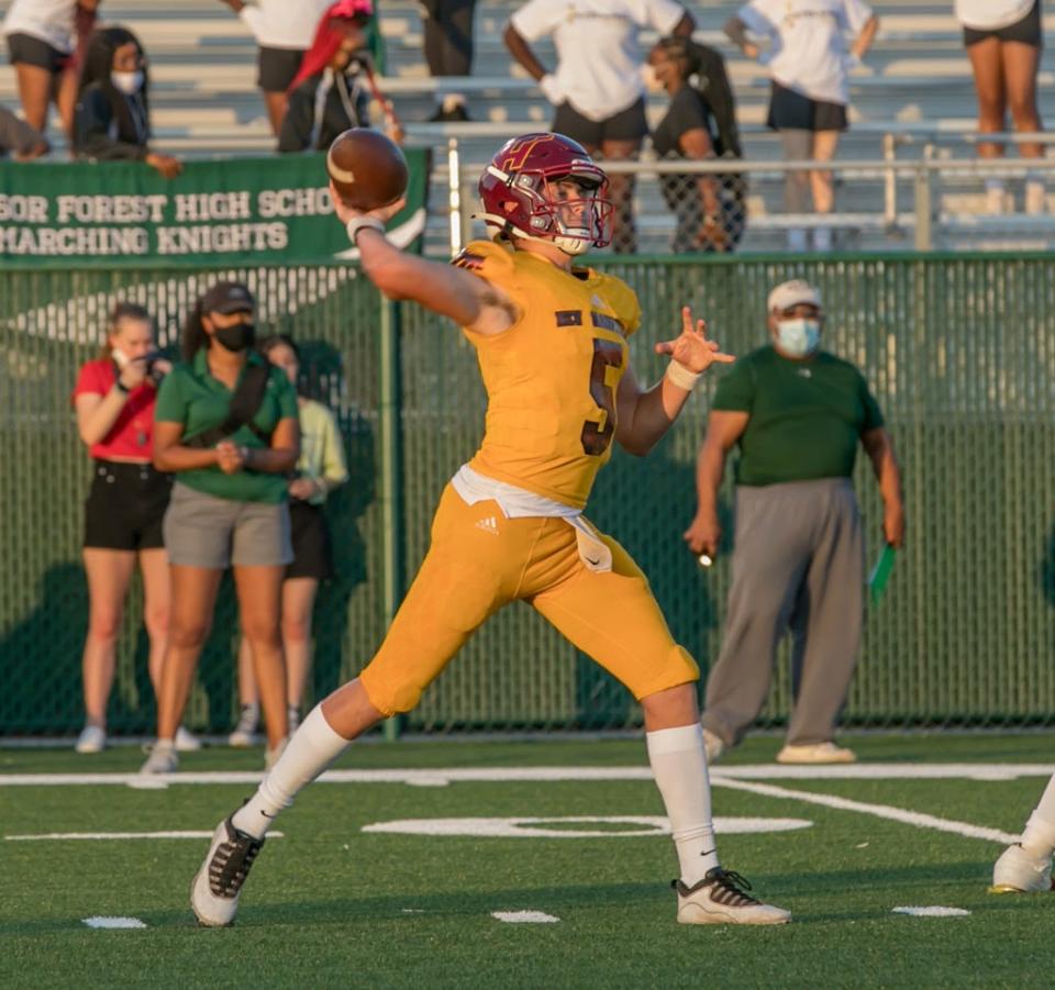 New Hampstead junior quarterback Pauly Seeley in action in a 2021 game against Windsor Forest at Pooler Stadium.