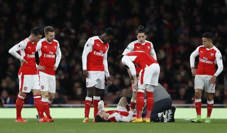 Britain Soccer Football - Arsenal v Leicester City - Premier League - Emirates Stadium - 26/4/17 Arsenal's Laurent Koscielny receives medical attention after sustaining an injury Reuters / Stefan Wermuth Livepic