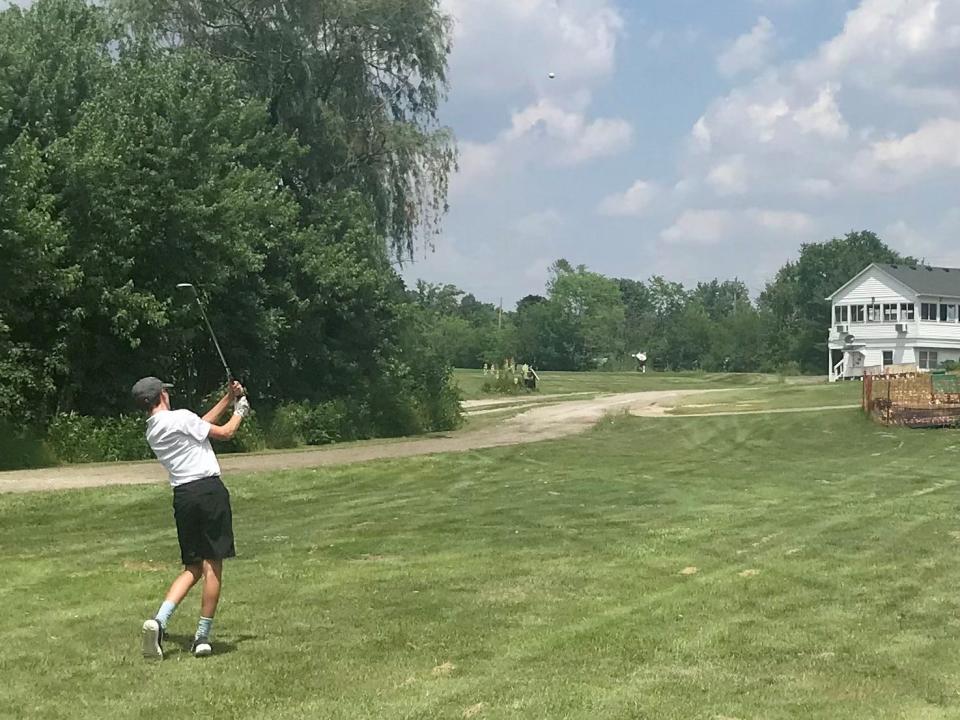 Jackson Burns makes an approach shot to the ninth hole during Wednesday's Heart of Ohio Junior Golf Association tournament at Marysville Country Club.