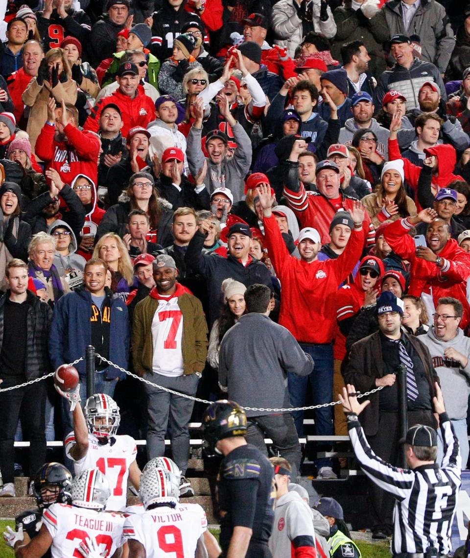 Ohio State Buckeyes fans celebrate after a touchdown from Ohio State Buckeyes wide receiver Chris Olave (17) during the second quarter of a NCAA Division I college football game between the Northwestern Wildcats and the Ohio State Buckeyes on Friday, Oct. 18, 2019 at Ryan Field in Evanston, Illinois.