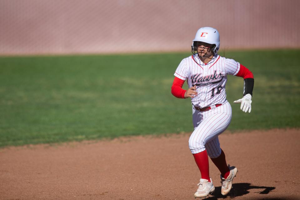 Centennial Hawk Stevie Jimenez runs to third base during a high school softball on Thursday, April 13, 2023, at the Field of Dreams. 