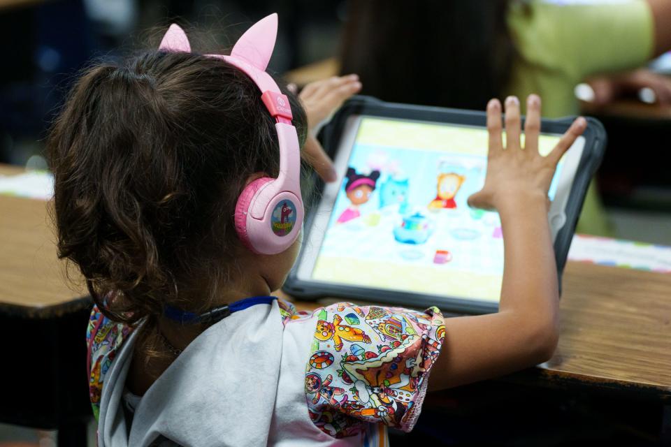 First grader Nicole Contreras uses Imagine Learning software on a tablet during class at Alhambra Traditional School on Aug. 28, 2023, in Phoenix.