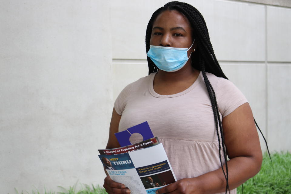 India Bell waits in line at a voting center in Baltimore on Tuesday, June 2, 2020 to vote in Maryland's primary. She said she thought the temperament of this year's election was heightened because of the state of the city. She said she feels like Baltimore has been in "a state of emergency for like the past decade, nearly." (AP Photo/Brian Witte)