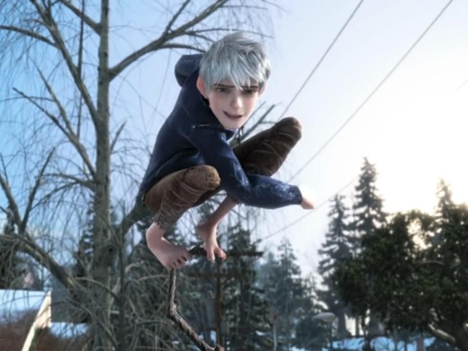 jack frost, a young man with silver hair, bare feet, and a blue hoodie who looks like a teenager. he's standing on the top of a staff, having just thrown a snowball
