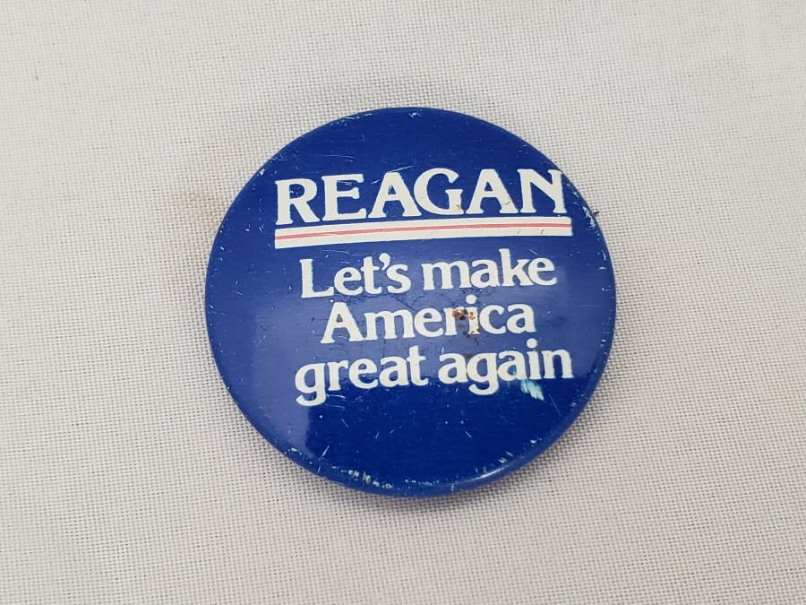 Close-up of pinback button with text reading “Reagan, Let’s Make America Great Again,” for Ronald Reagan’s 1980 Presidential election campaign, September 26, 2019. (Photo by Smith Collection/Gado/Getty Images)