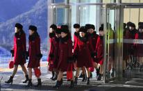 <p>North Korean cheerleaders walk to their accomodation at the Inje Speedium, a racetrack and hotel complex, in Inje, north of Pyeongchang, on February 7, 2018 ahead of the Pyeongchang Winter Olympic Games. </p>