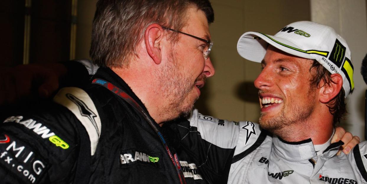 ross brawn and jenson button celebrate winning the title in 2009