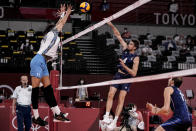 Italy's Luca Vettori, second right, hits a ball during the men's volleyball quarterfinal match between Italy and Argentina at the 2020 Summer Olympics, Tuesday, Aug. 3, 2021, in Tokyo, Japan. (AP Photo/Manu Fernandez)