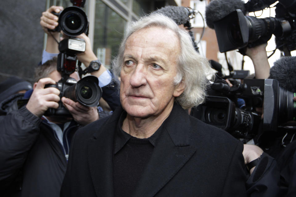 FILE - Journalist, John Pilger, a supporter of Wikileaks founder Julian Assange arrives at the City of Westminster Magistrates Court in London where Julian Assange is in court for his bail hearing, Tuesday, Dec. 14, 2010. John Pilger, the Australia-born journalist and documentary maker known for his coverage of the Khmer Rouge in Cambodia, has died. He was 84. (AP Photo/Sang Tan, File)