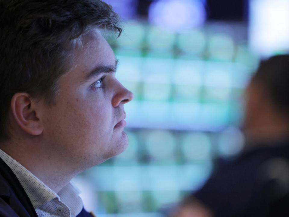 A trader works on the trading floor at the New York Stock Exchange (NYSE) in Manhattan, New York City