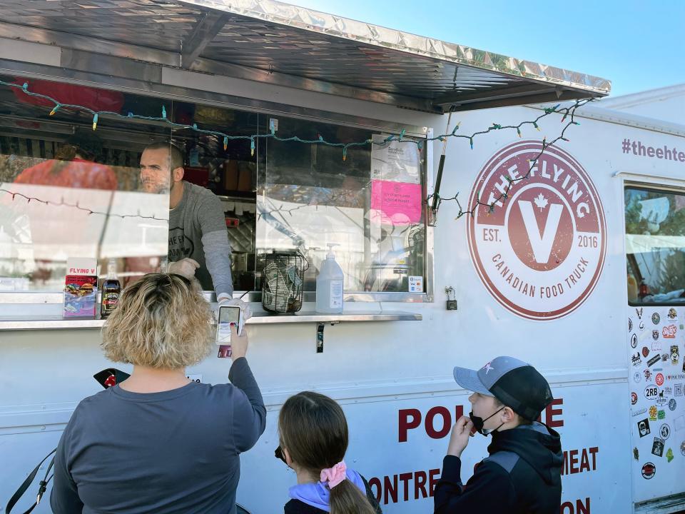 The Flying V Canadian Food Truck dished out pounds of poutine, dressed up in a variety of ways to lines of hungry customers.