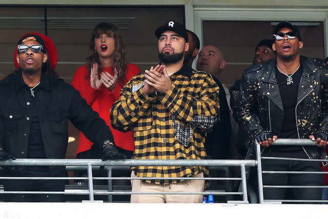 <p>Rob Carr/Getty</p> Taylor Swift, Ross Travis, Aric Jones look on during the second quarter in the AFC Championship Game between the Baltimore Ravens and the Kansas City Chiefs at M&T Bank Stadium on January 28, 2024 in Baltimore, Maryland.