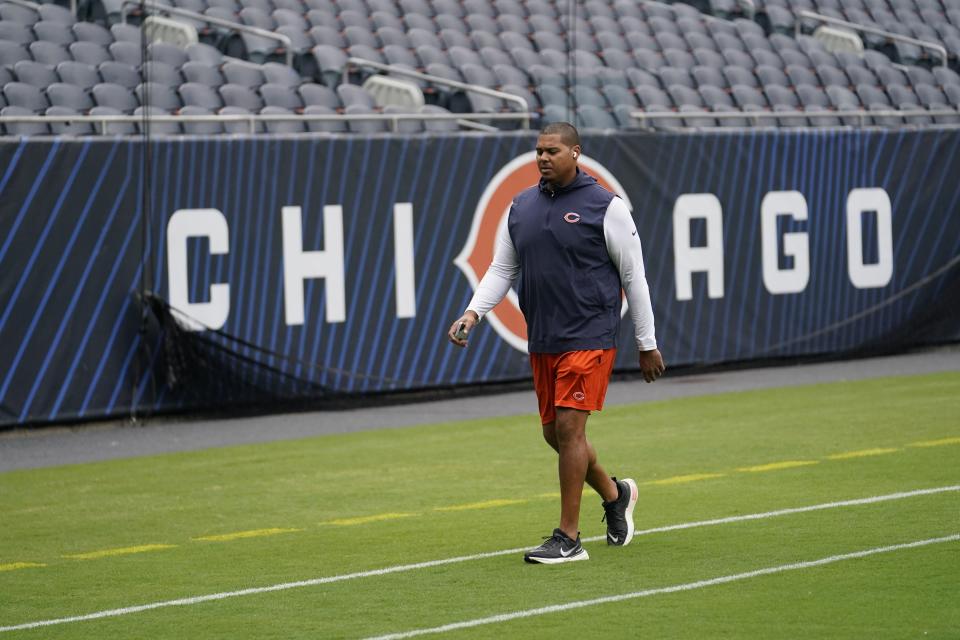 Chicago Bears general manager Ryan Poles walks on the field before an NFL preseason football game against the Buffalo Bills, Saturday, Aug. 26, 2023, in Chicago. (AP Photo/Charles Rex Arbogast)