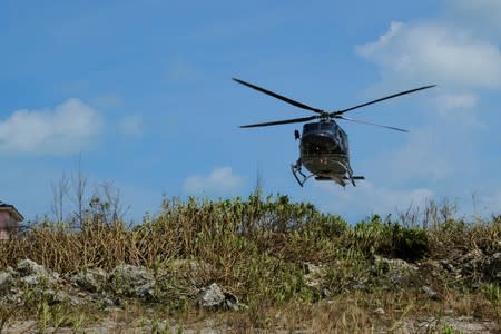 An unidentified helicopter lands at the Marsh Harbor Medical Clinic in the aftermath of Hurricane Dorian in Marsh Harbour