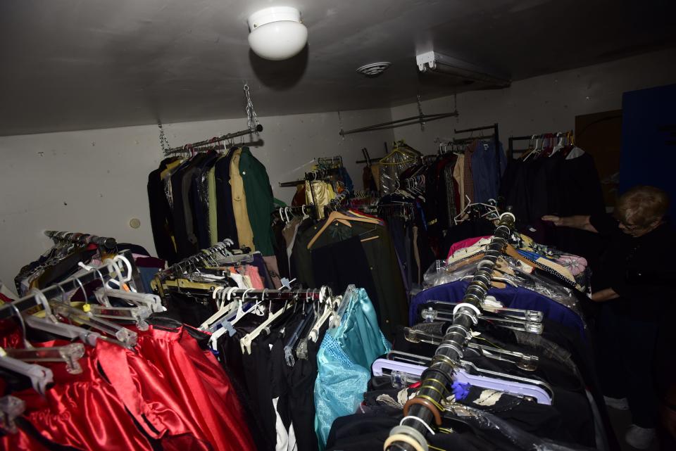 Past president of the St. Clair Theatre Guild Sue Daniels browses around the costume room inside the theatre's storage facility at Klecha Park in St. Clair on Wednesday, August 3, 2022.