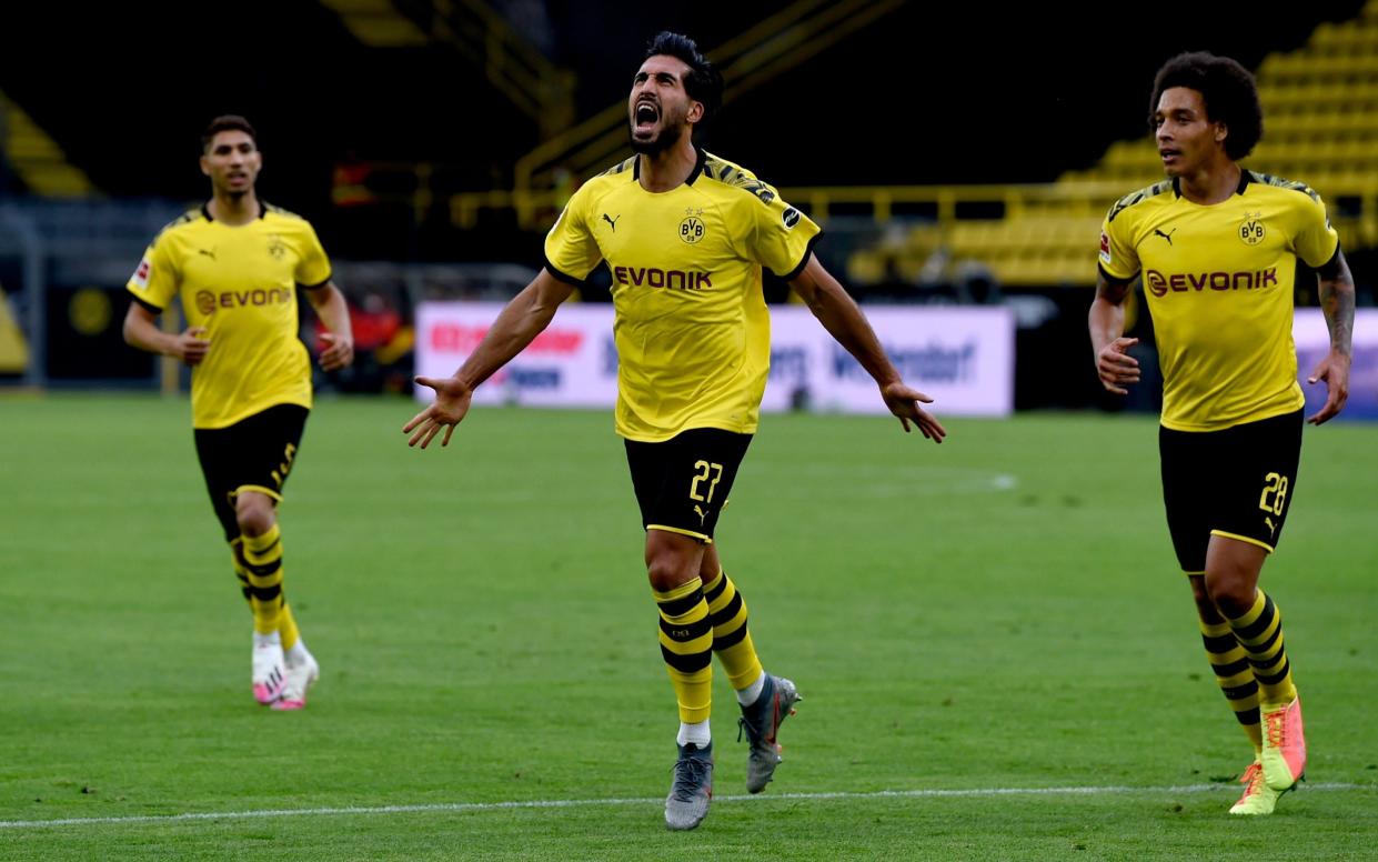 Emre Can (C) of Borussia Dortmund celebrates after scoring his team's first goal with his teammates Axel Witsel (R) and Achraf Hakimi (L) of Borussia Dortmund during the Bundesliga match between Borussia Dortmund and Hertha BSC at Signal Iduna Park on June 06, 2020 in Dortmund, Germany -  Alexandre Simoes/Borussia Dortmund via Getty Images