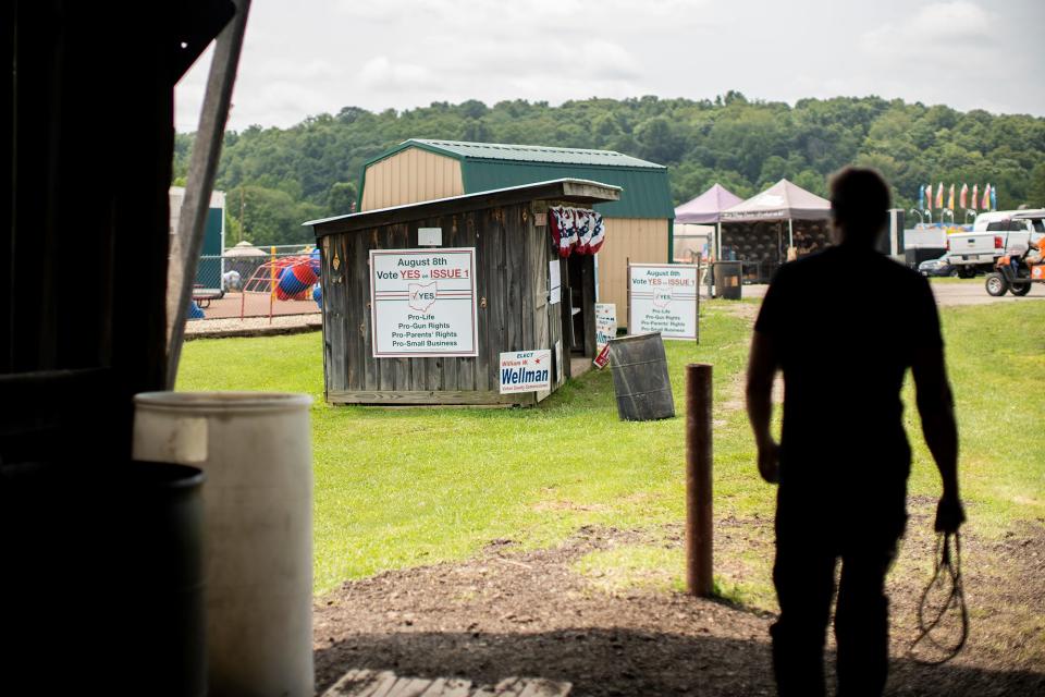 u0022Vote yesu0022 signs sit at the empty Republican Party booth at the Vinton County Jr. Fair on July 28.