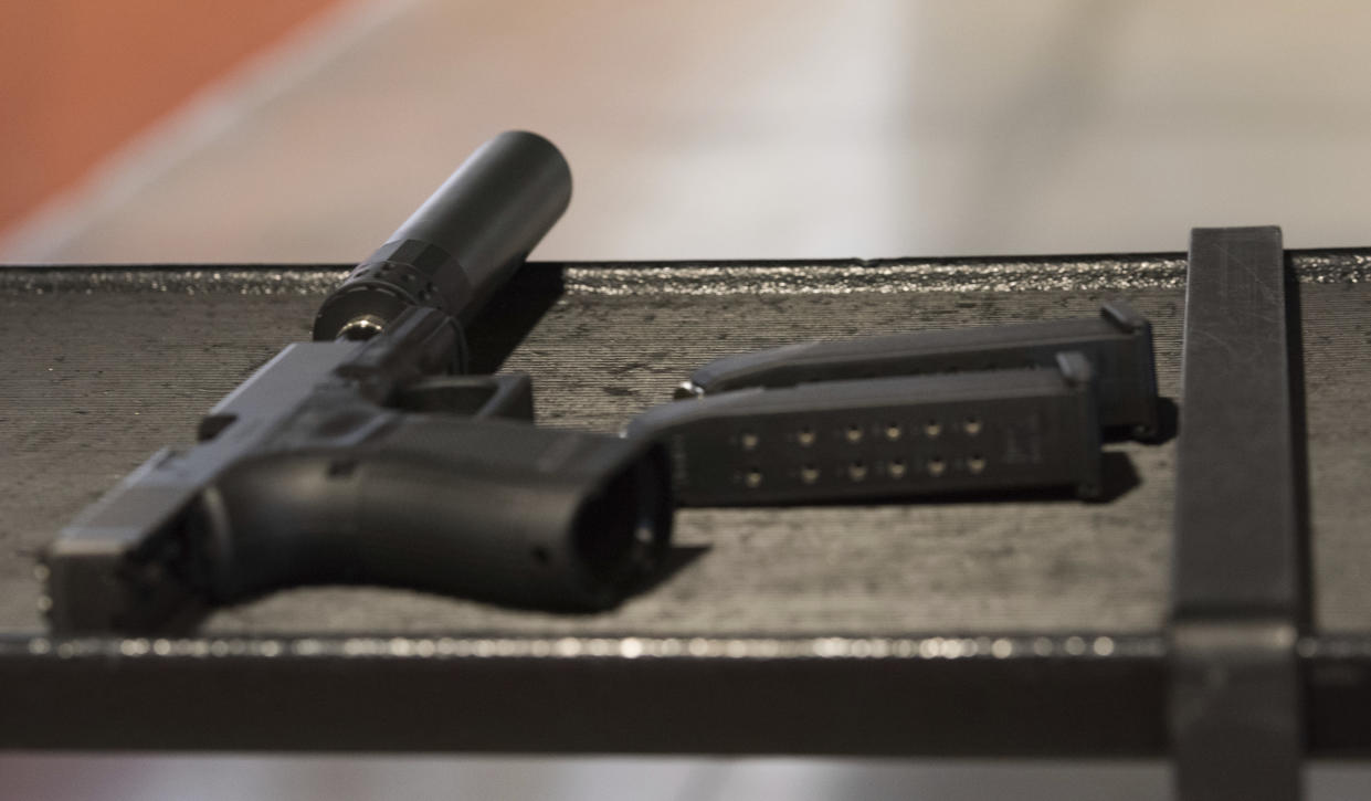 In this photo taken Jan. 27, 2017, a handgun with a silencer and two magazines are shown at a gun range in Atlanta. (Photo: Lisa Marie Pane/AP)