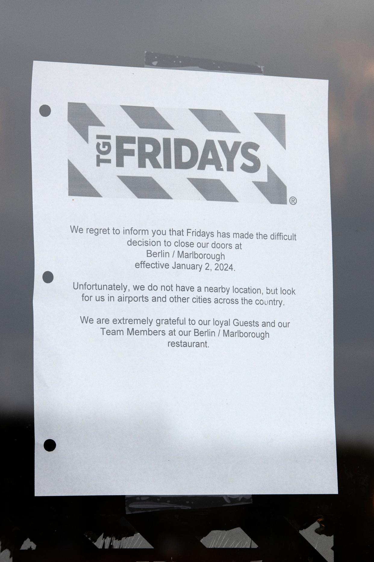 TGI Fridays left this message on the front door of its Solomon Pond Mall location in Marlborough, alerting diners that the restaurant had closed.