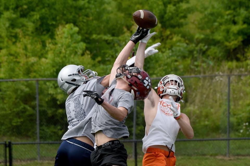 Dominic Costa, Terrill Williams and Reece Huber vie for the ball during a practice for the Licking County all-star football team on Wednesday, June 8, 2022 at Granville High School. Licking County will take on Muskingum Valley on Friday, June 17.