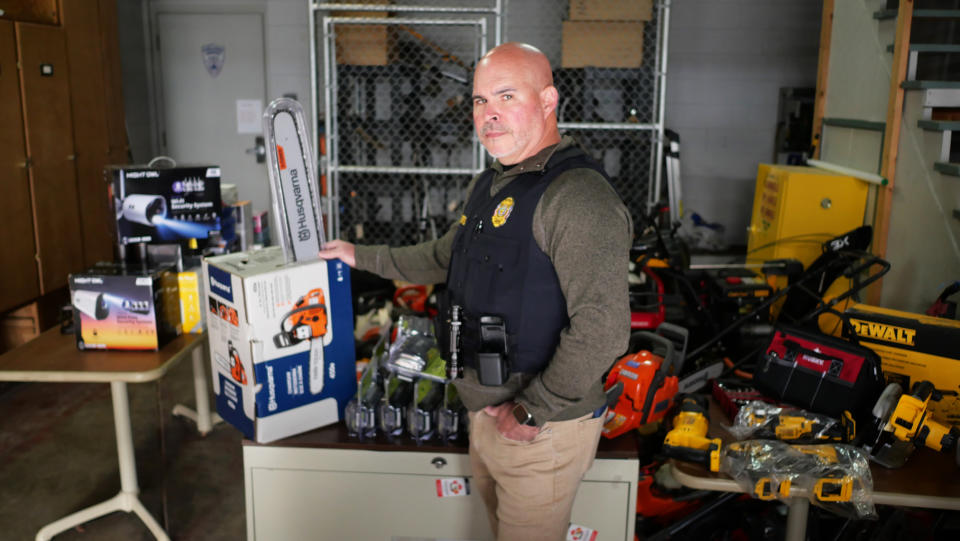 Det. Sgt. Todd Curtis of the Perrysburg Township Police Department holds a stolen Husqvarna chainsaw that he bought from Richard Nye off of Facebook Marketplace in an undercover buy. (David Paredes / NBC News)