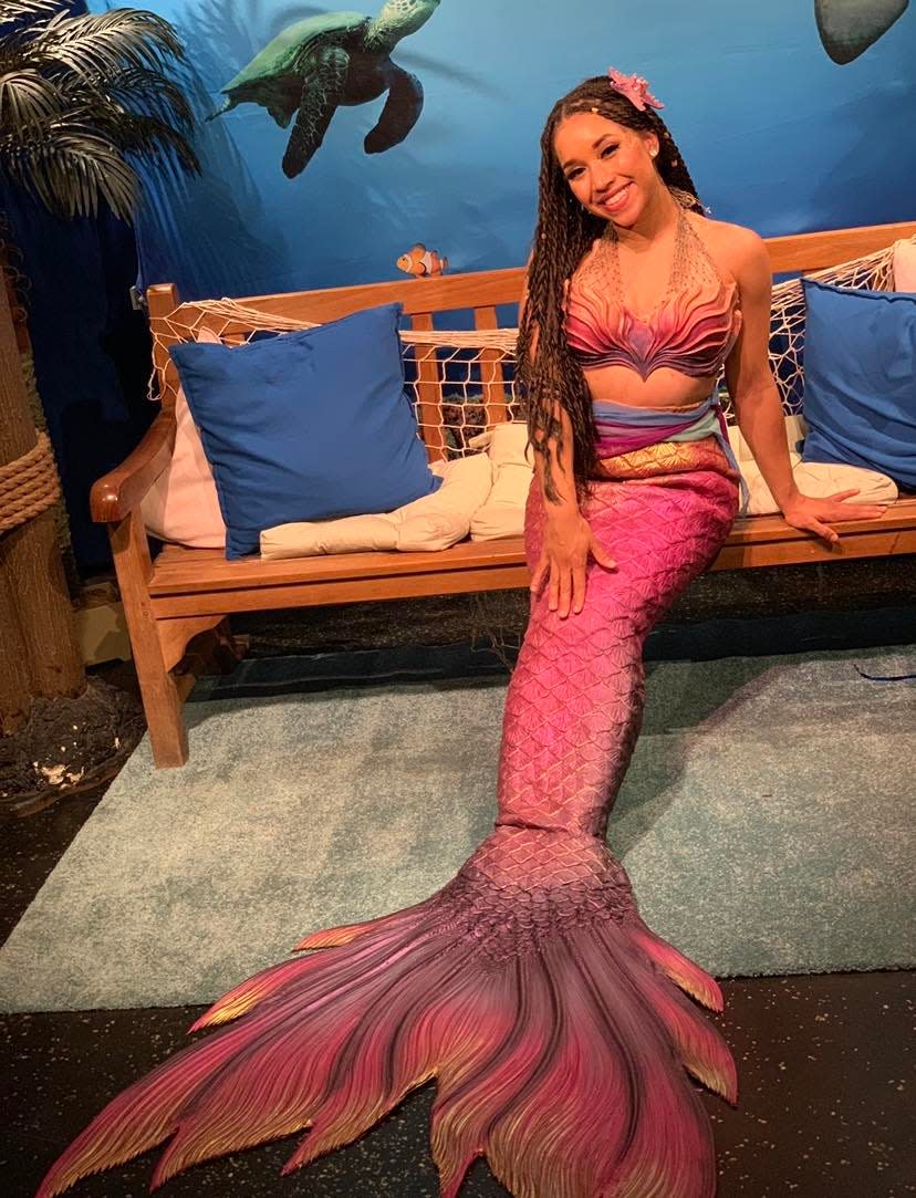 Imari Stout poses for a portrait in a Finfolks Productions mermaid tail. Stout is a professional mermaid performer with Wands and Wishes Mermaids. She performs under the stage name Mermaid Naia.