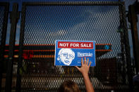 <p>A supporter of Senator Bernie Sanders holds a placard in protest at the perimeter walls of the 2016 Democratic National Convention in Philadelphia, Pennsylvania, July 26, 2016. (Photo: Adrees Latif/Reuters)</p>