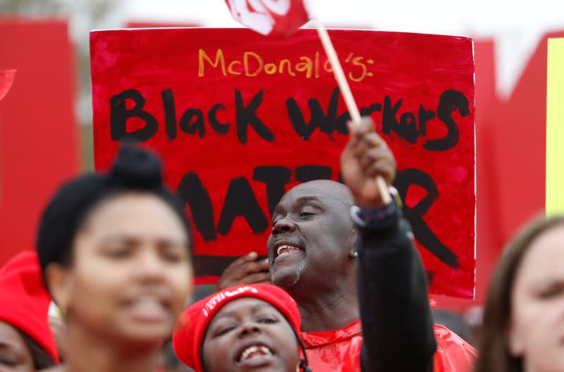 Protestors shout union slogans before the arrival of Democratic U.S. presidential candidate and former South Bend Mayor Pete Buttigieg during a march with striking McDonald's workers in Charleston