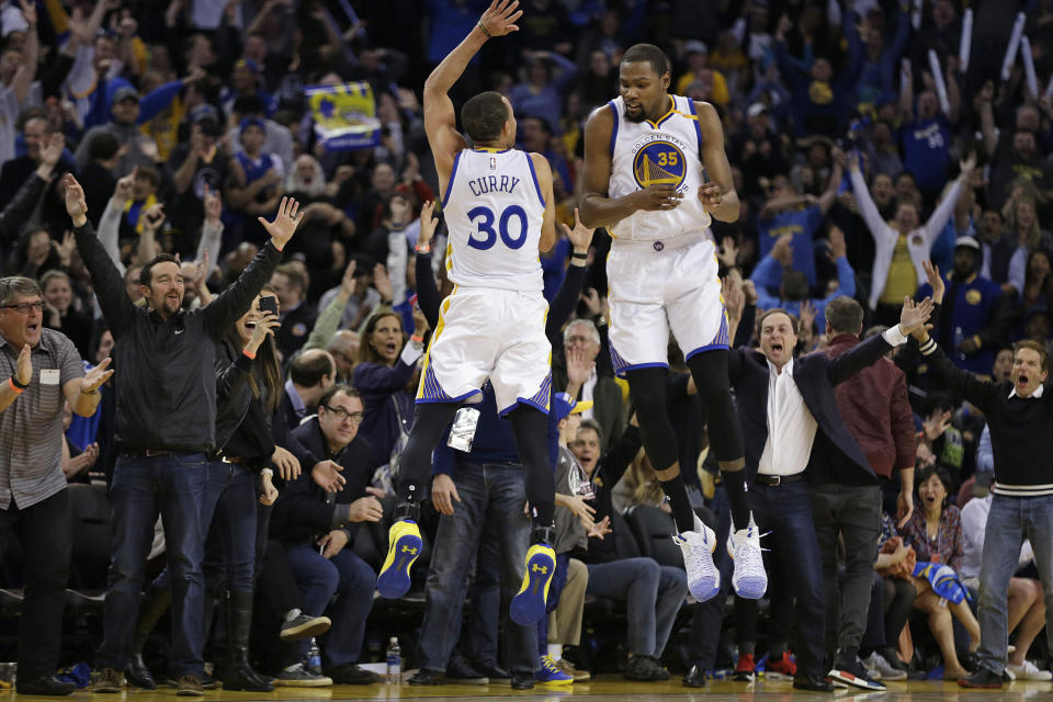 Stephen Curry and Kevin Durant may wear the same uniform, but they can’t agree on shoes. (AP)