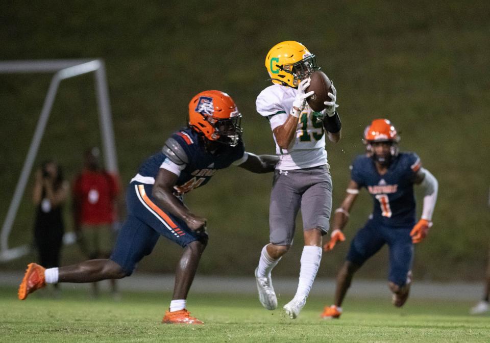 Geno Cummingham (15) pulls in a pass during the Pensacola Catholic vs Escambia football game at Escambia High School in Pensacola on Friday, Sept. 1, 2023.