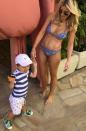 <p>Roxy made the most of the warm weather last Summer, pictured here in a bikini while at the beach with her son Hunter in December.</p>