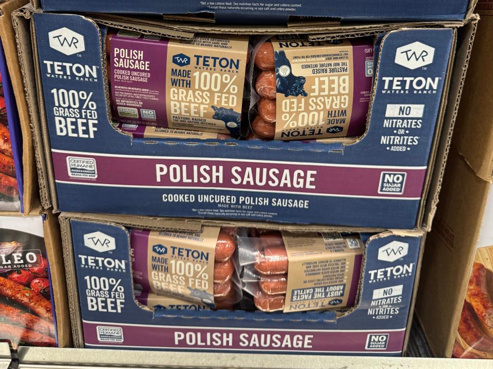 Teton Waters Ranch beef Polish sausage packages stacked in cardboard boxes in Costco