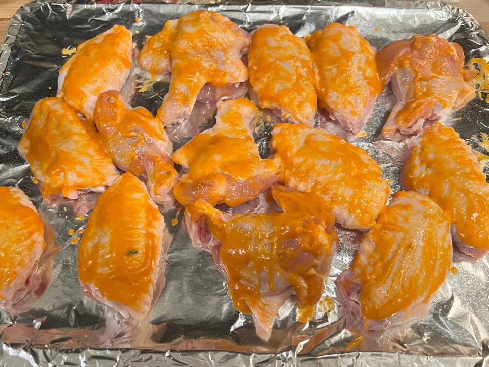 Raw chicken wings with sauce