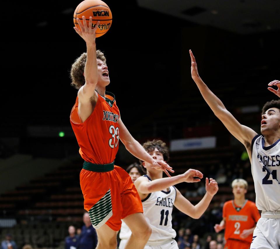 Porterville's Camden Haynes drives against Arroyo Grande during their Central Section Division IV Boys Championship game at Selling Arena in Fresno, Calif., Friday, Feb. 24, 2023.