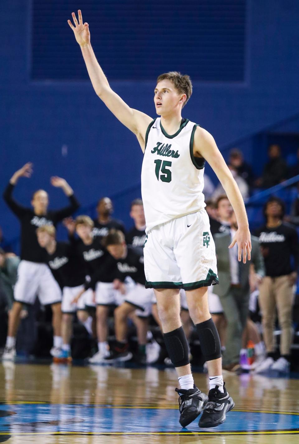 Tower Hill's Davis Bland celebrates a three-pointer in the first half of a DIAA state tournament semifinal against Seaford at the Bob Carpenter Center Thursday, March 10, 2022.