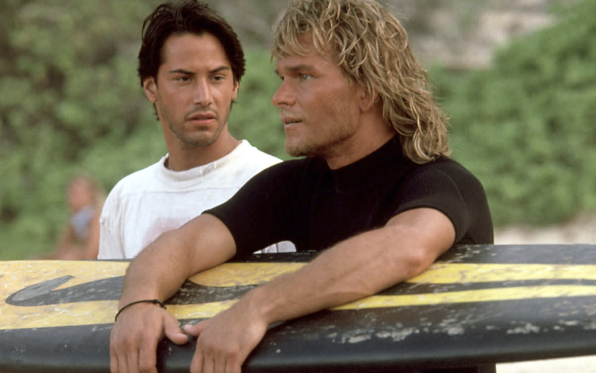 Keanu Reeves and Patrick Swayze in "Point Break" (1991)<p>©20th Century Studios/Everett Collection</p>